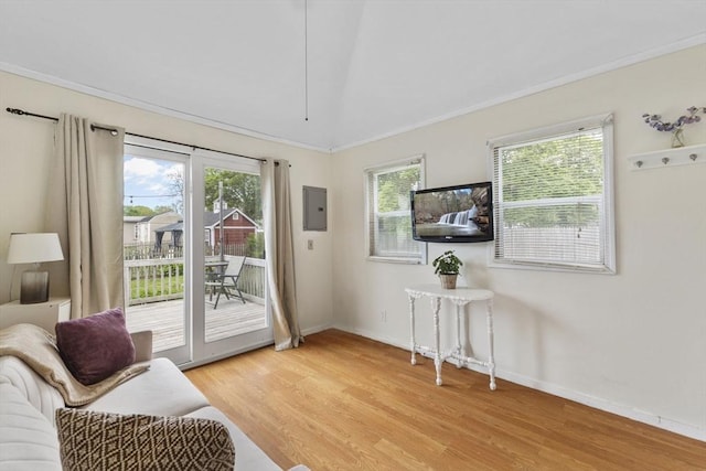 34 13th St, Wareham, MA 02532 - sitting room with light wood finished floors, healthy amount of natural light, baseboards, and ornamental molding