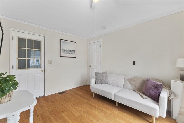 34 13th St, Wareham, MA 02532 - living room with light wood-type flooring, baseboards, and ornamental molding