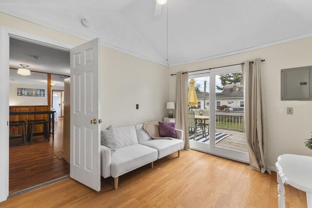 34 13th St, Wareham, MA 02532 - living area with electric panel, light wood-style floors, vaulted ceiling, and ceiling fan
