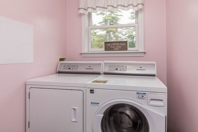 laundry room with washing machine and clothes dryer