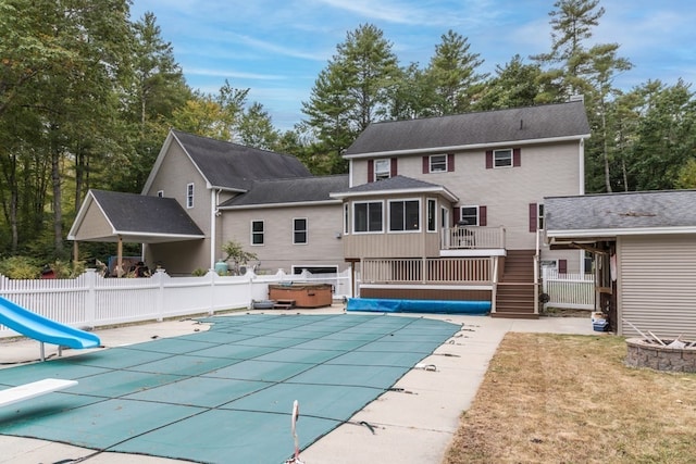 view of pool with a hot tub and a patio area