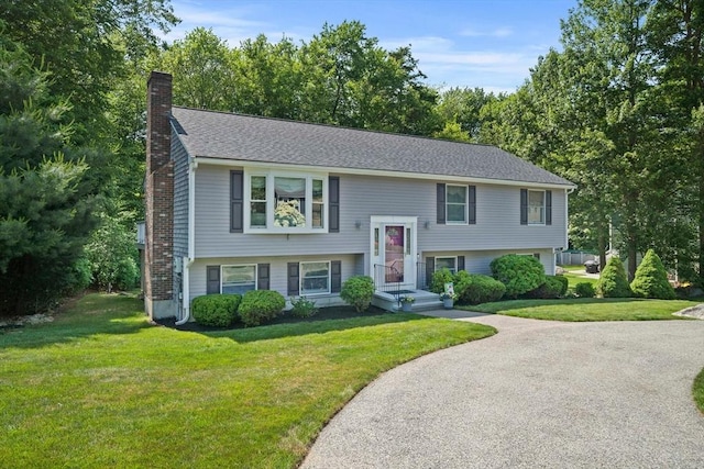 47 Pheasant Hill Rd, Weymouth, MA 02190 - raised ranch featuring a chimney and a front lawn