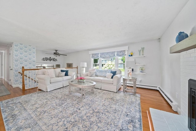47 Pheasant Hill Rd, Weymouth, MA 02190 - living room with a fireplace, wood finished floors, and a ceiling fan