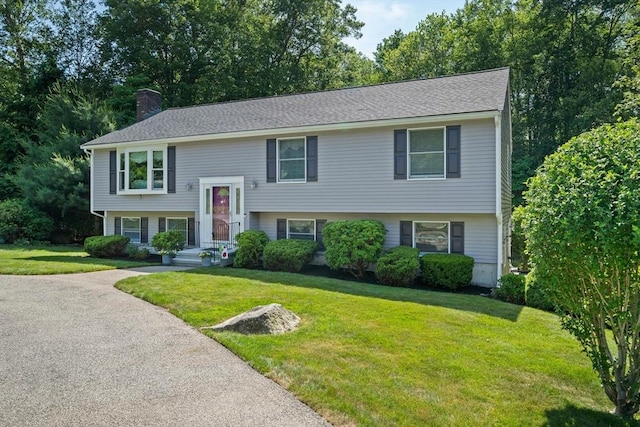 47 Pheasant Hill Rd, Weymouth, MA 02190 - bi-level home featuring a chimney and a front yard