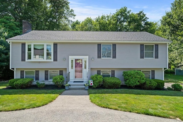 47 Pheasant Hill Rd, Weymouth, MA 02190 - split foyer home with a chimney and a front yard