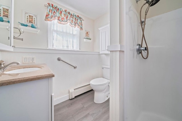47 Pheasant Hill Rd, Weymouth, MA 02190 - full bathroom with a baseboard radiator, a stall shower, vanity, wainscoting, and wood finished floors