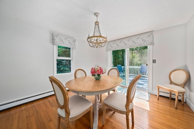 47 Pheasant Hill Rd, Weymouth, MA 02190 - dining space with a chandelier, a baseboard heating unit, and light wood-type flooring
