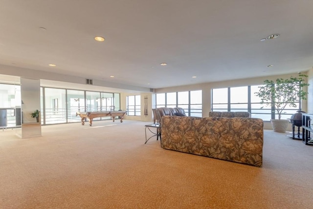 living room with billiards and light carpet