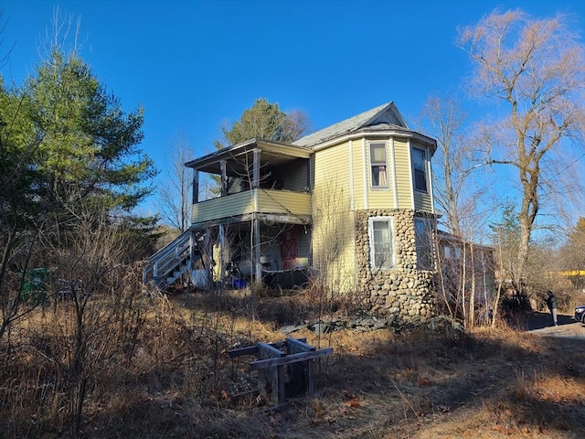 back of house with a balcony