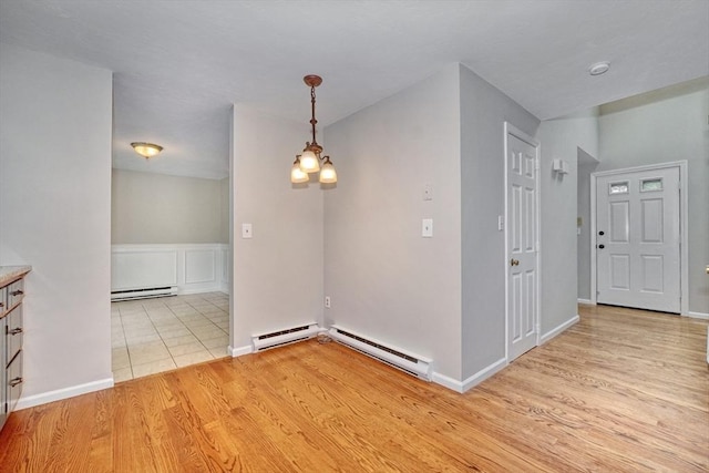 47 Key St Unit 47, Millis, MA 02054 - unfurnished room with a baseboard heating unit and light wood-style flooring