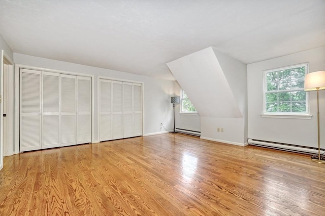47 Key St Unit 47, Millis, MA 02054 - additional living space featuring a baseboard heating unit and light wood-type flooring