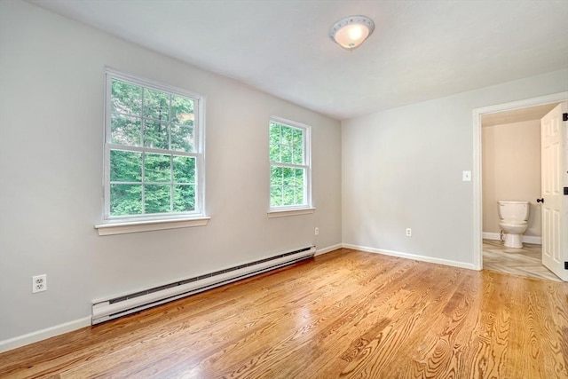 47 Key St Unit 47, Millis, MA 02054 - spare room featuring a baseboard heating unit and light wood-style floors