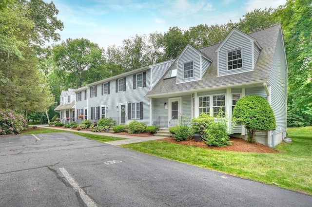 47 Key St Unit 47, Millis, MA 02054 - colonial-style house featuring uncovered parking, a front lawn, and a shingled roof