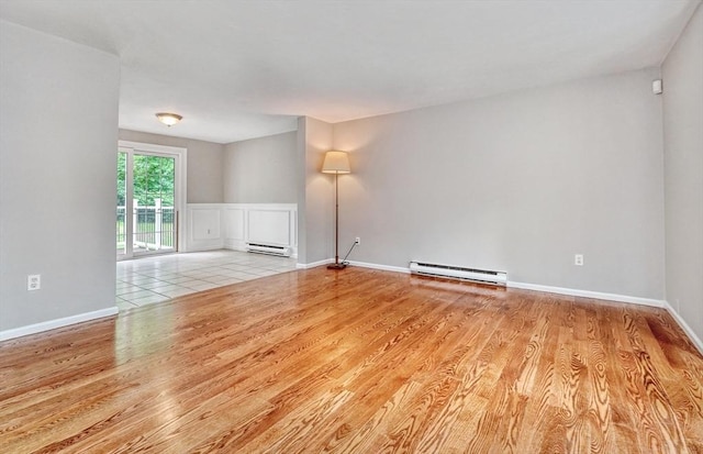47 Key St Unit 47, Millis, MA 02054 - unfurnished room featuring a baseboard radiator and wood finished floors