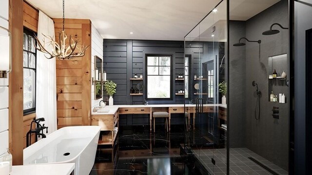 bathroom with tile patterned floors, independent shower and bath, a notable chandelier, and vanity