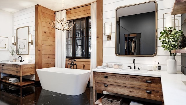 bathroom with vanity, wooden walls, and a bathtub