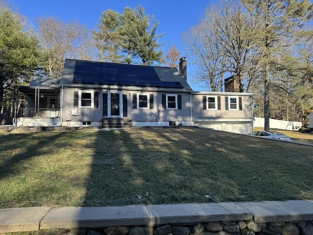 view of front of house featuring a porch, a front yard, and solar panels