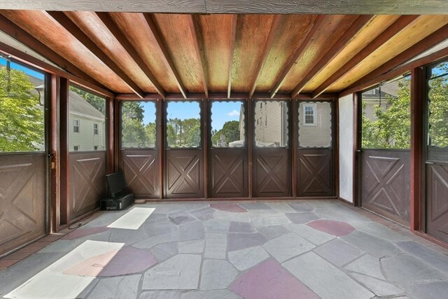 120 Readville St, Boston, MA 02136 - unfurnished sunroom featuring a wood stove and vaulted ceiling