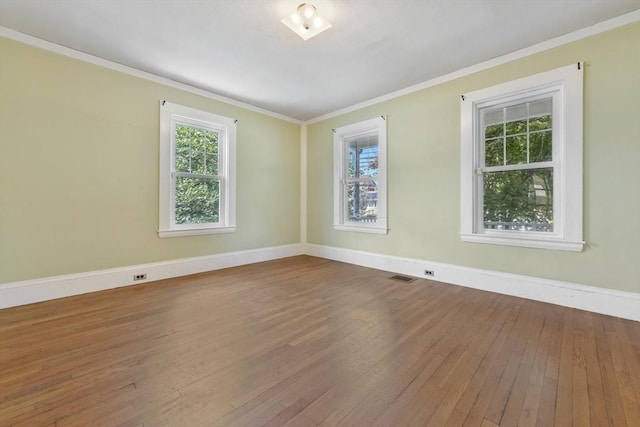 120 Readville St, Boston, MA 02136 - unfurnished room featuring hardwood / wood-style floors, healthy amount of natural light, baseboards, and crown molding