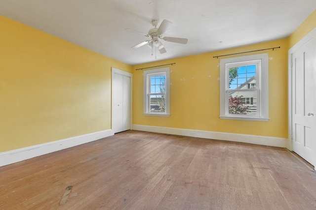 120 Readville St, Boston, MA 02136 - unfurnished room featuring plenty of natural light, baseboards, wood finished floors, and ceiling fan
