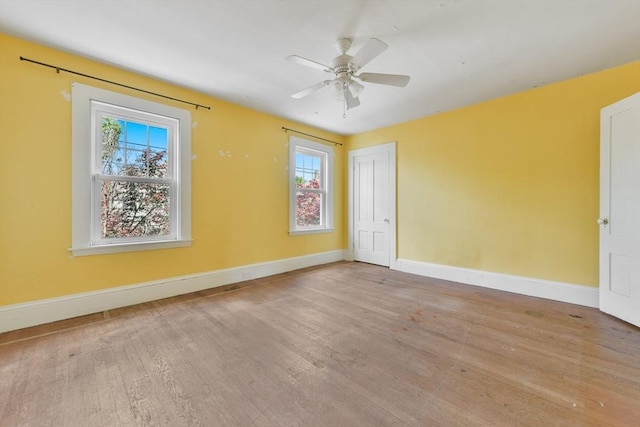 120 Readville St, Boston, MA 02136 - unfurnished room featuring plenty of natural light, wood finished floors, baseboards, and a ceiling fan