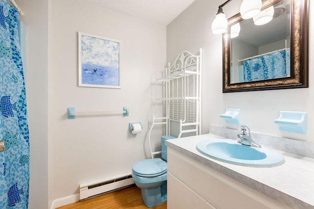 94 Pine View Dr, Brewster, MA 02631 - bathroom featuring a baseboard radiator, vanity, wood finished floors, and a shower with shower curtain