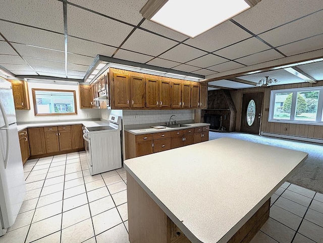 22-24 Newton Ave, Tewksbury, MA 01876 - kitchen featuring range with electric stovetop, freestanding refrigerator, a paneled ceiling, light tile patterned floors, and light countertops