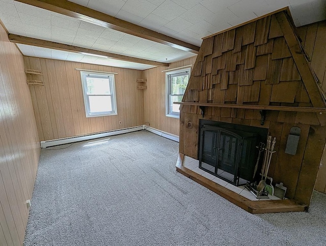 22-24 Newton Ave, Tewksbury, MA 01876 - unfurnished living room with carpet, wood walls, beam ceiling, a fireplace, and a baseboard heating unit