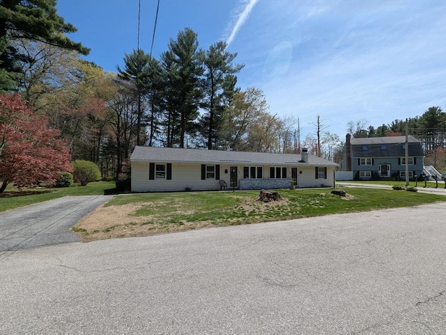 22-24 Newton Ave, Tewksbury, MA 01876 - single story home featuring a front yard and a chimney