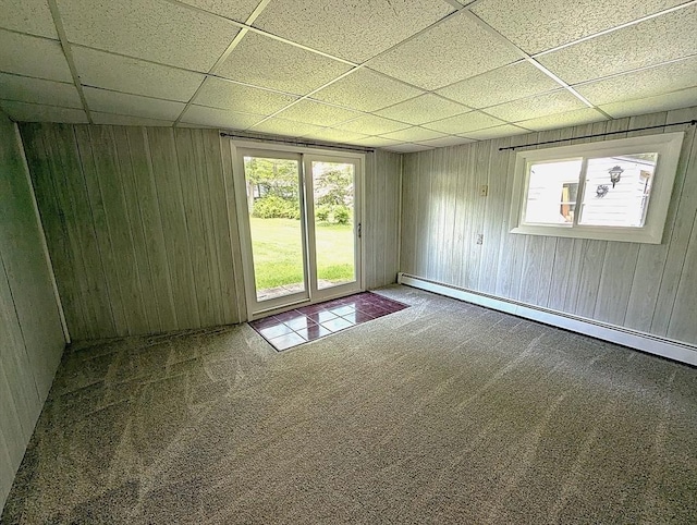 22-24 Newton Ave, Tewksbury, MA 01876 - spare room featuring a drop ceiling, carpet flooring, baseboard heating, and wooden walls