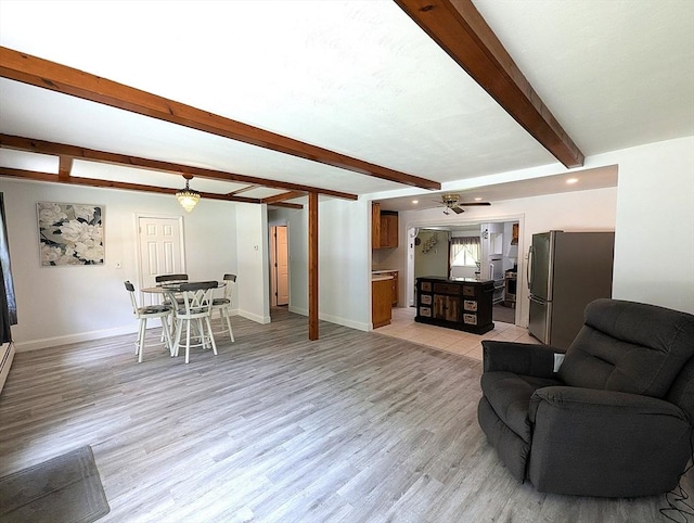 22-24 Newton Ave, Tewksbury, MA 01876 - living area featuring beamed ceiling, baseboards, light wood-style floors, and ceiling fan
