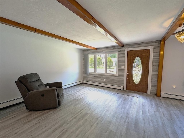 22-24 Newton Ave, Tewksbury, MA 01876 - foyer entrance with wood finished floors, beamed ceiling, and a baseboard radiator