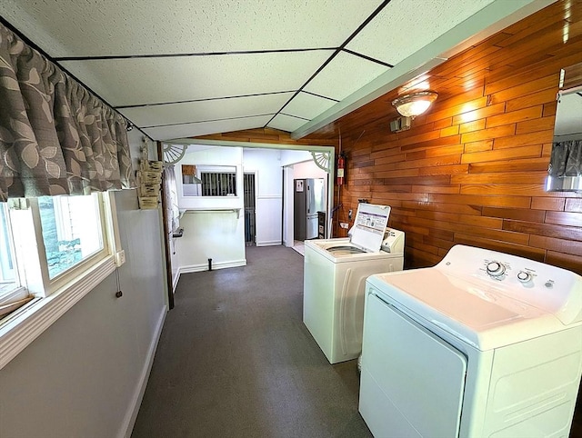 22-24 Newton Ave, Tewksbury, MA 01876 - laundry room with separate washer and dryer, wood walls, and baseboards