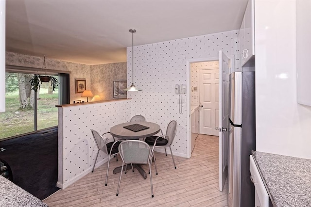 1 Astra Unit 1, Wayland, MA 01778 - dining room featuring light wood-type flooring, baseboards, and wallpapered walls