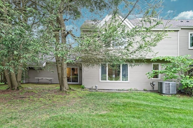 1 Astra Unit 1, Wayland, MA 01778 - back of property with central AC unit and a lawn