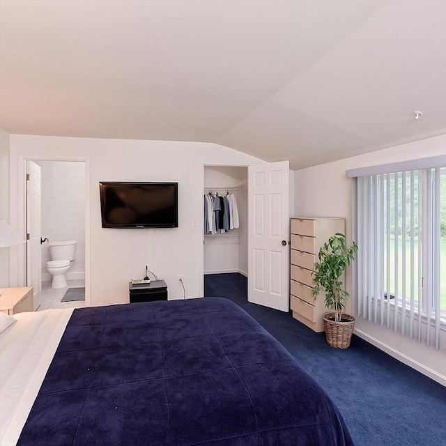 1 Astra Unit 1, Wayland, MA 01778 - bedroom featuring carpet floors, vaulted ceiling, ensuite bathroom, a walk in closet, and baseboards