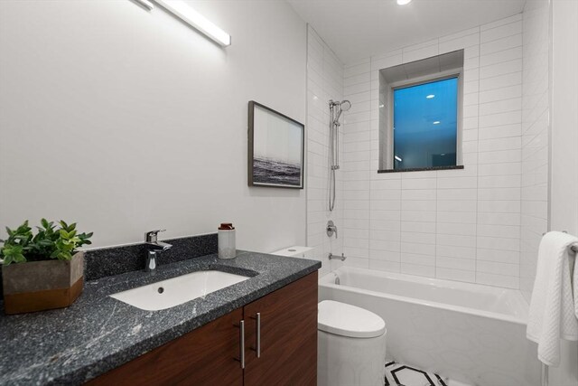 110 Harvard St, Newton, MA 02460 - bathroom featuring washtub / shower combination, vanity, and toilet
