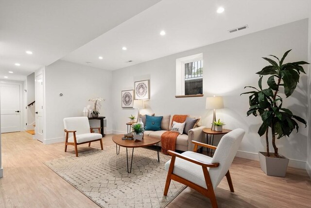 110 Harvard St, Newton, MA 02460 - living area with baseboards, recessed lighting, stairway, visible vents, and light wood finished floors