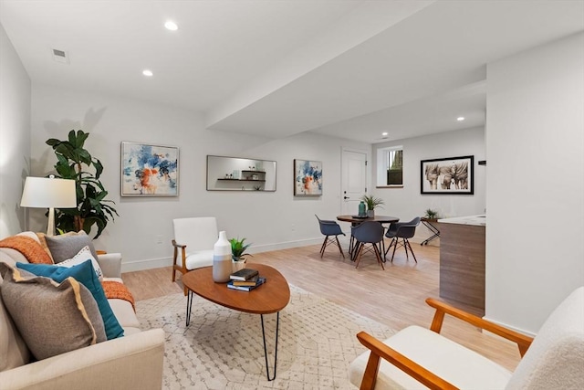 110 Harvard St, Newton, MA 02460 - living area with visible vents, baseboards, recessed lighting, and light wood-style floors
