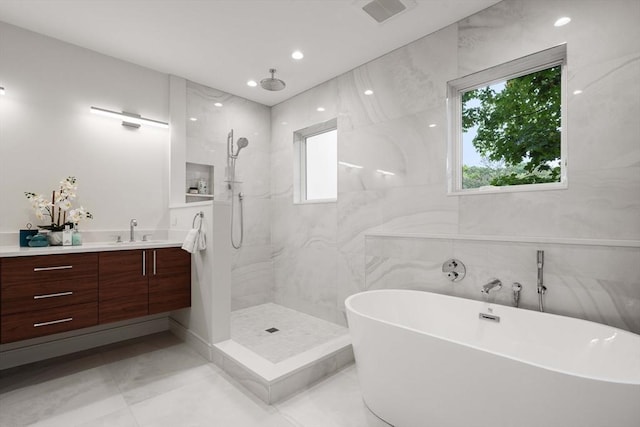 110 Harvard St, Newton, MA 02460 - bathroom featuring a wealth of natural light, visible vents, a freestanding bath, and a walk in shower