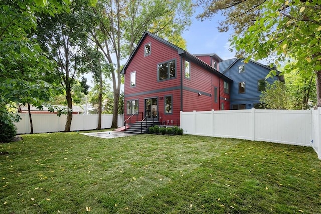 110 Harvard St, Newton, MA 02460 - back of property with a fenced backyard and a lawn