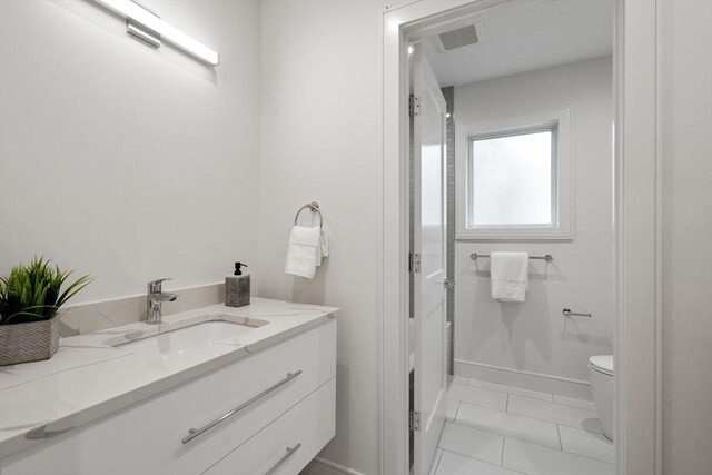 110 Harvard St, Newton, MA 02460 - bathroom featuring vanity, visible vents, and toilet