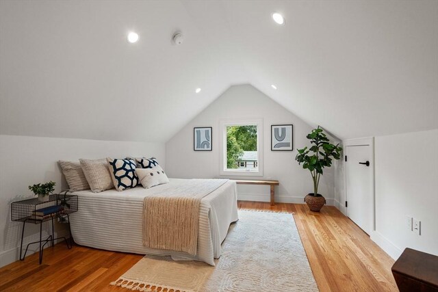 110 Harvard St, Newton, MA 02460 - bedroom with recessed lighting, baseboards, light wood-type flooring, and vaulted ceiling