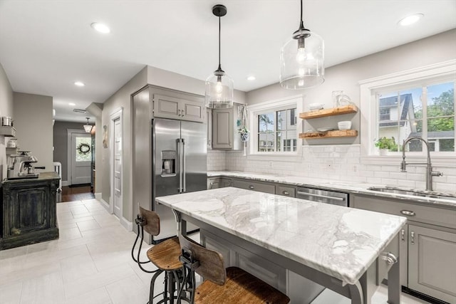 26 Woodward Ave, Reading, MA 01867 - kitchen featuring gray cabinetry, stainless steel appliances, a sink, tasteful backsplash, and recessed lighting