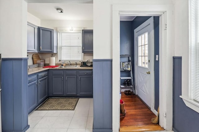 kitchen with sink and light tile patterned flooring