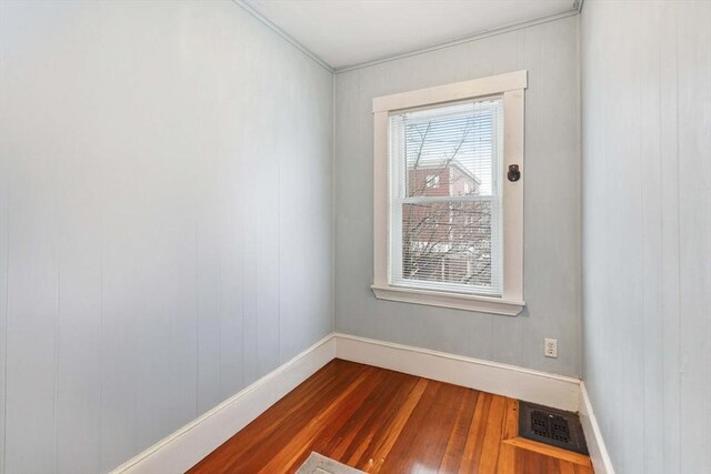 unfurnished room featuring wood-type flooring