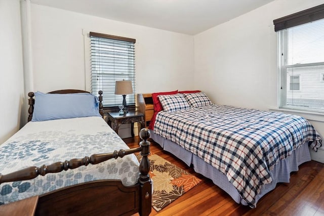 bedroom featuring dark hardwood / wood-style flooring