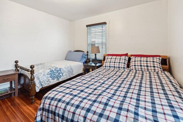 bedroom featuring dark hardwood / wood-style flooring