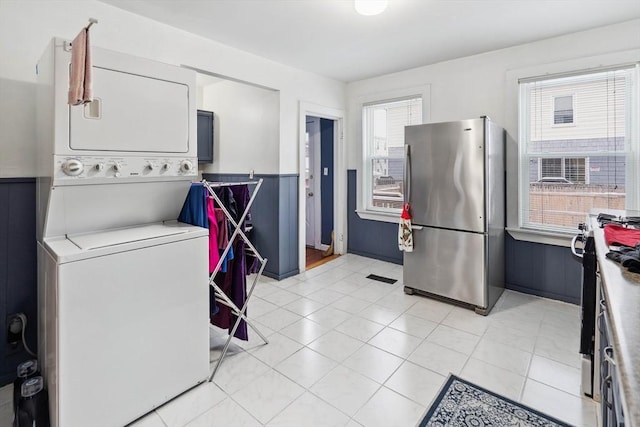 laundry area with stacked washer / drying machine