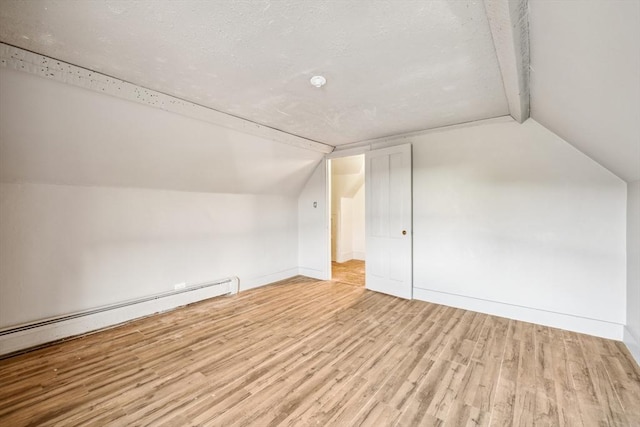 79 Wapping Rd, Kingston, MA 02364 - additional living space featuring a baseboard radiator, lofted ceiling, wood finished floors, and baseboards